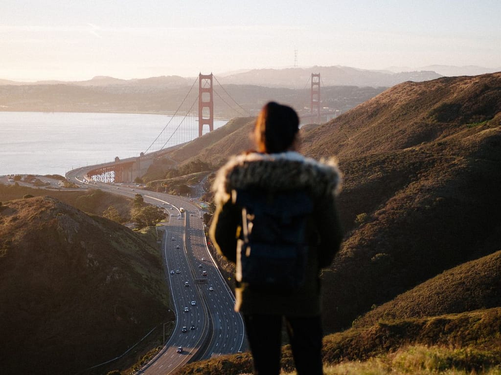 person looking at the golden gate bridge