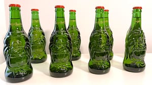 Line of Lucky Buddha Beer bottles on table