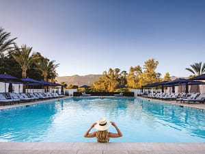 woman relaxing poolside at Ojai Valley Inn